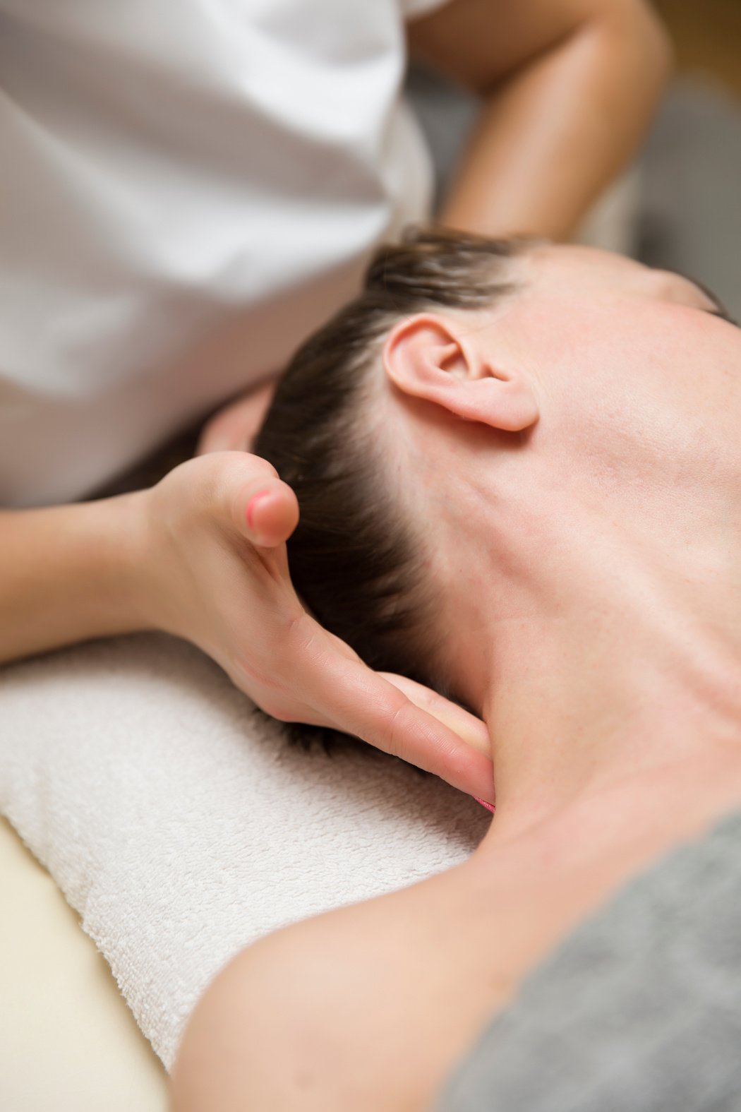 Woman Getting a Stress Relieving Pressure Point Massage on Her N